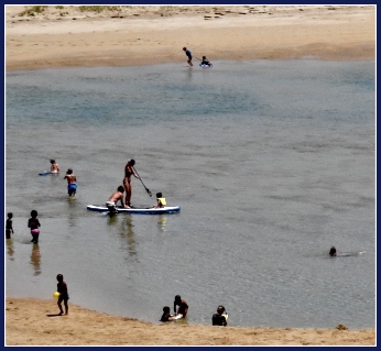 December holidays-girl SUPing at the River-mouth