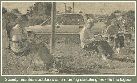 Artists sketching at the water's edge