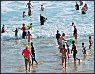 Bathers playing in the surf at Myoli Beach