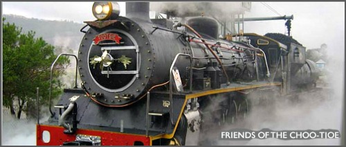 The impressive steam engine about to leave the station The impressive steam engine about to leave the station