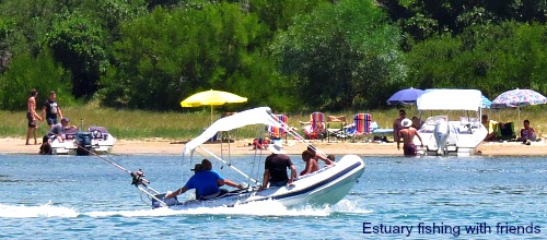 Visitors fishing on the Swartvlei Estuary with friends at Christmas time. Visitors fishing on the Swartvlei Estuary with friends at Christmas time.