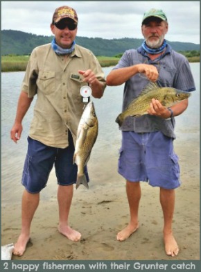 Two happy fishermen with their catch of Grunter. Two happy fishermen with their catch of Grunter.
