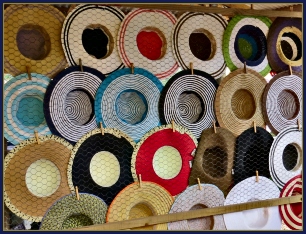 Bright brimmed hats at the Mosaic Market