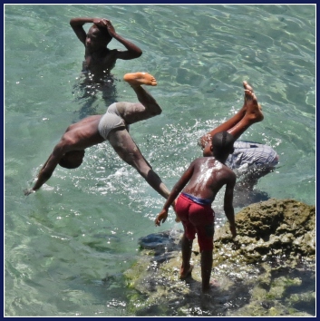 Children playing in the crystal waters at the river mouth