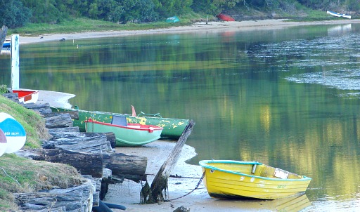 Boats rest in morning tranquillity at the  Kingfisher Drive launch-site on Swartvlei Estuary.