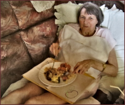 Mom having lunch on the couch at home in Pretoria.
