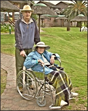 Dad pushing Mom around Pine Lake Marina in her wheelchair on her last visit.