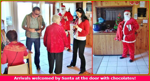 Santa welcomes everyone with chocolates Santa welcomes everyone with chocolates