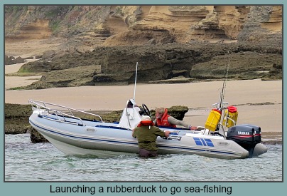 Launching a rubber duck from Swartvlei Beach near Gerickes Point to go sea fishing. Launching a rubber duck from Swartvlei Beach near Gerickes Point to go sea fishing.