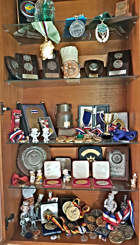 Shelves of Colin's Medals