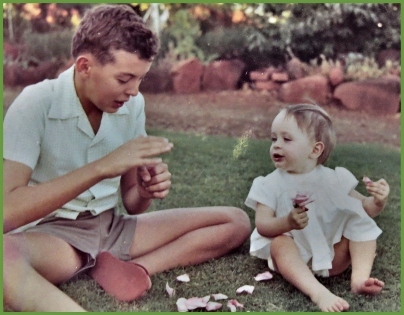 Steve playing in the garden with 6 month old Elizabeth.